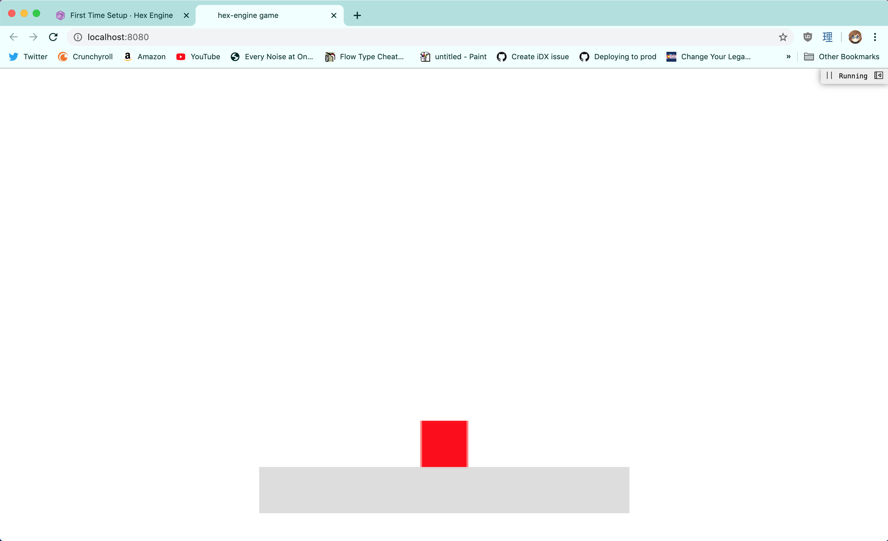 Screenshot of the default game created by create-hex-engine-game. A red box is sitting on a grey platform, set against a white background.